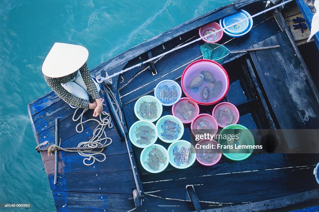 Woman Selling Crabs on Boat