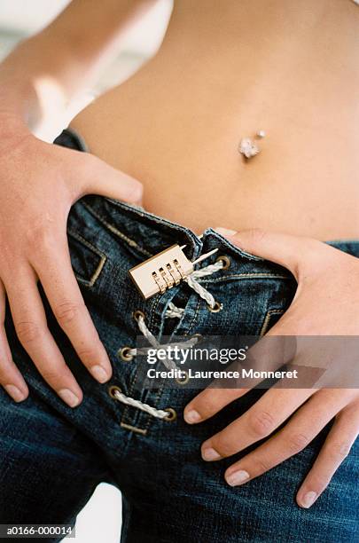 padlock on girl's jeans - intim piercing bildbanksfoton och bilder