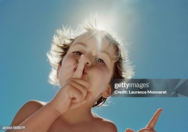 boy whispering - fluisteren stockfoto's en -beelden