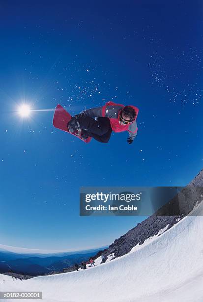 snowboarder jumping - snowboard jump close up stock pictures, royalty-free photos & images