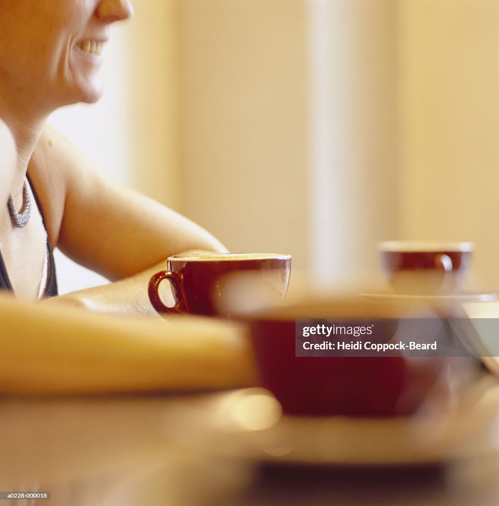 Woman and Coffee Cups