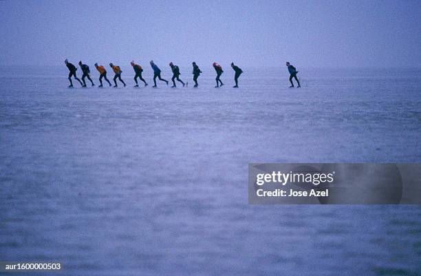 eleven ice skaters synchronized in action, holland, europe. - ice skater stock pictures, royalty-free photos & images
