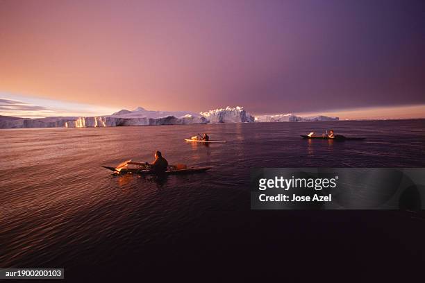 traditional inuit kayaking in disko bay - arctic triple stock pictures, royalty-free photos & images