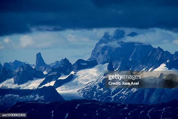 distant view of mountain ranges covered with snow and clouds, alaska, usa. - distant imagens e fotografias de stock