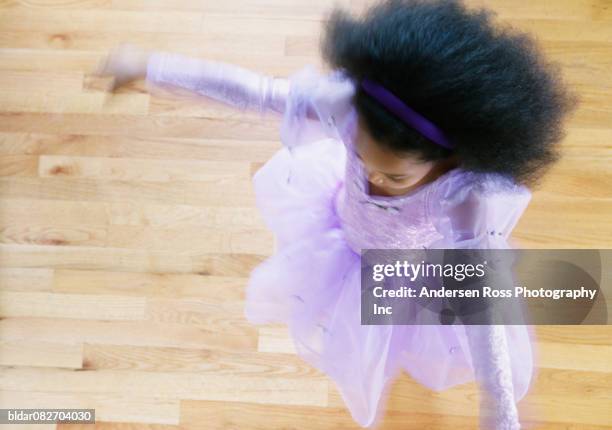 high angle view of a young girl dancing in ballet costume - ballett mädchen stock-fotos und bilder