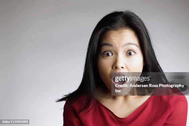 portrait of woman looking surprised - person mouth open stock pictures, royalty-free photos & images