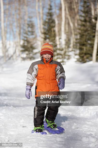 portrait of a boy standing - calças para esquiar imagens e fotografias de stock