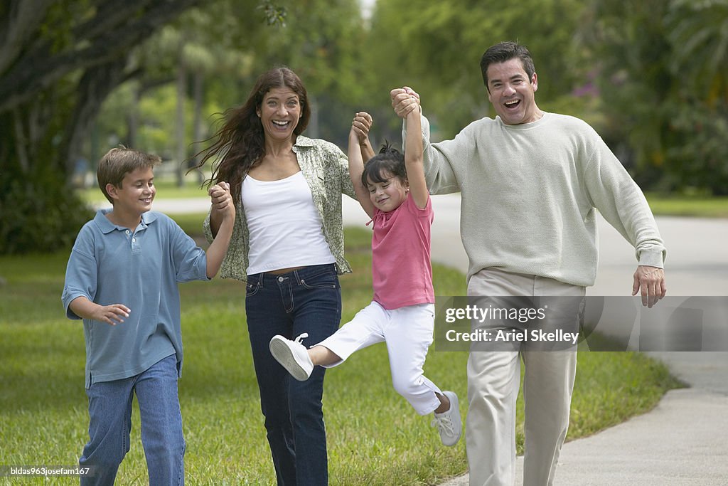 Portrait of a family walking in the park