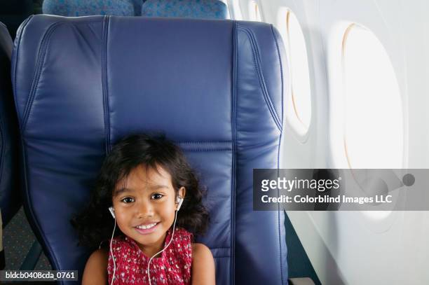 Portrait of girl sitting in an air plane