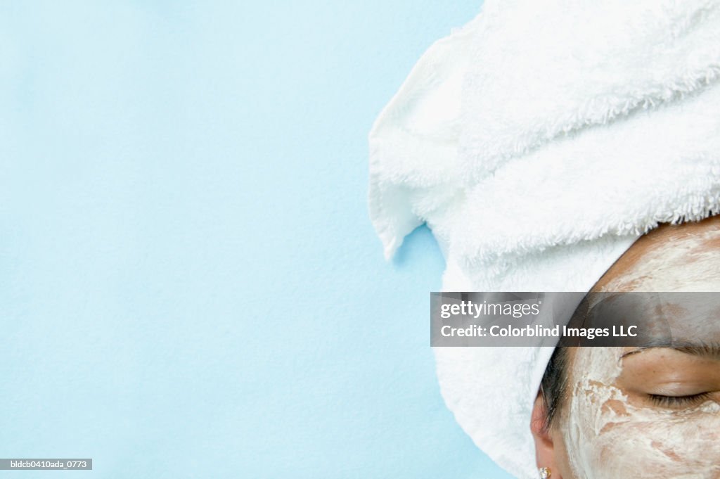 Close-up of a young woman wearing a facial mask