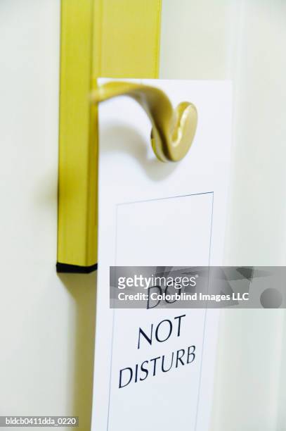 do not disturb sign hanging on the door handle - why not stock pictures, royalty-free photos & images
