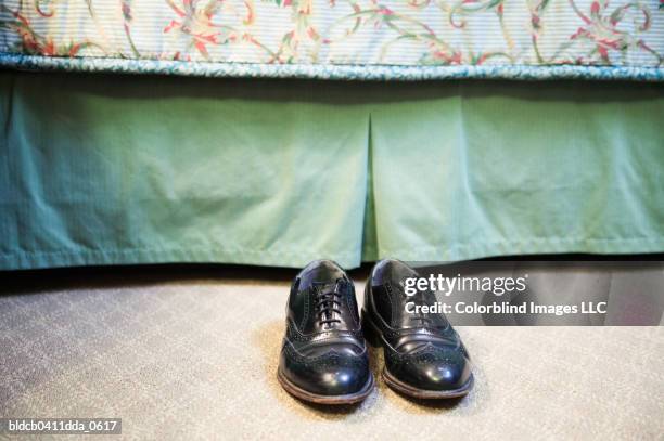 pair of shoes in a room - eleganter schuh stock-fotos und bilder