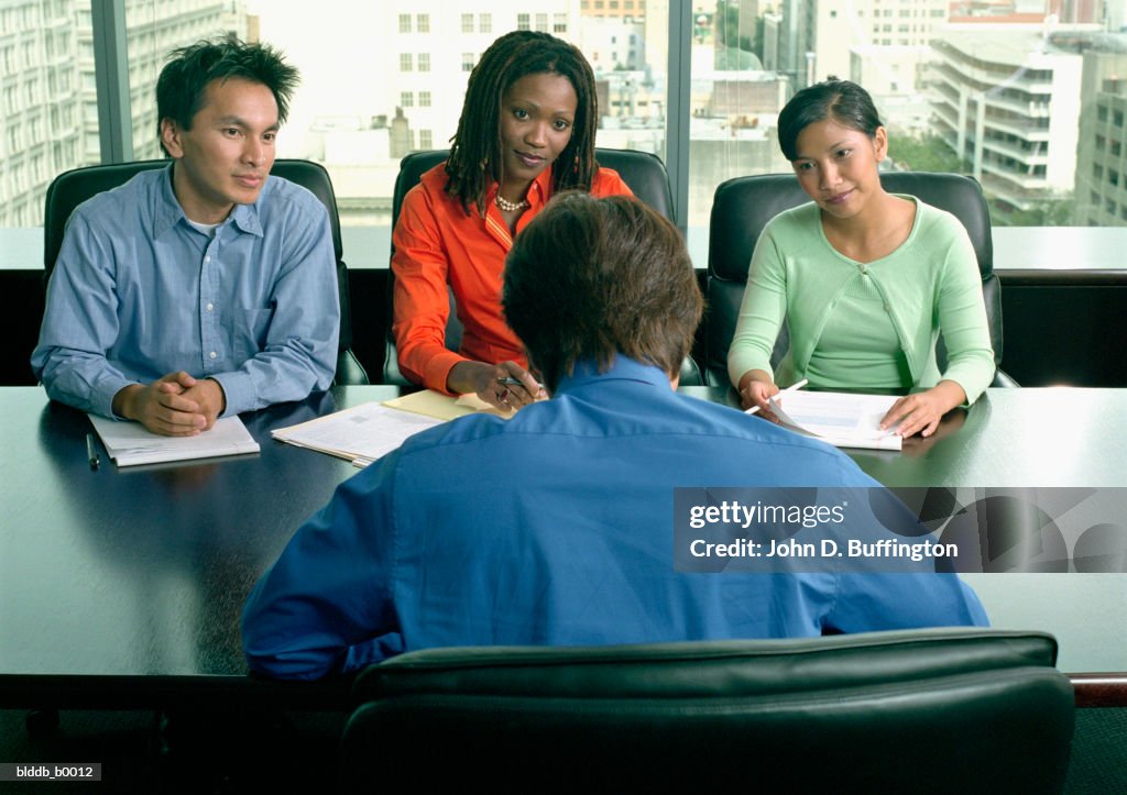 High angle view of four business executives in a meeting