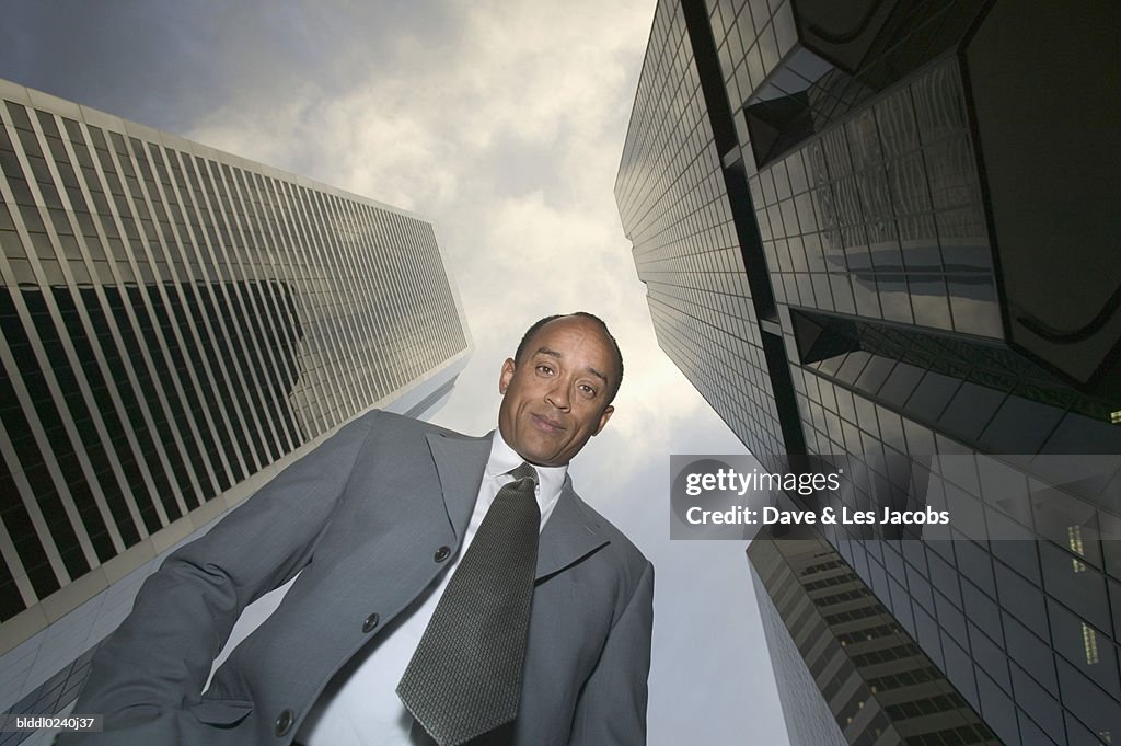 Low angle view of mid adult businessman looking at camera