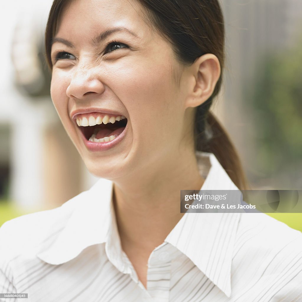 Young businesswoman laughing
