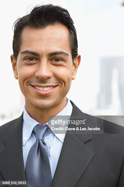 portrait of a businessman smiling - dave and les jacobs stock-fotos und bilder