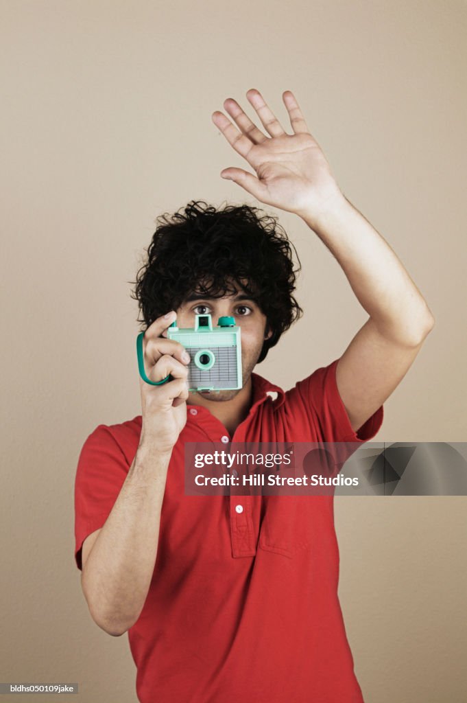 Close-up of a young man taking a photograph