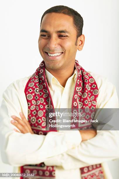 young man standing wearing a traditional outfit - blend stockfoto's en -beelden