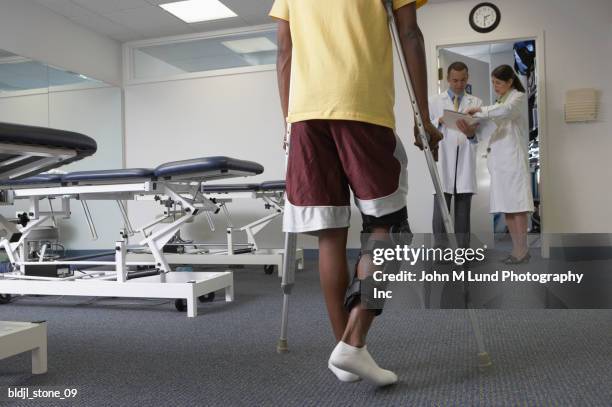 patient using leg braces - orthopaedic equipment stock pictures, royalty-free photos & images