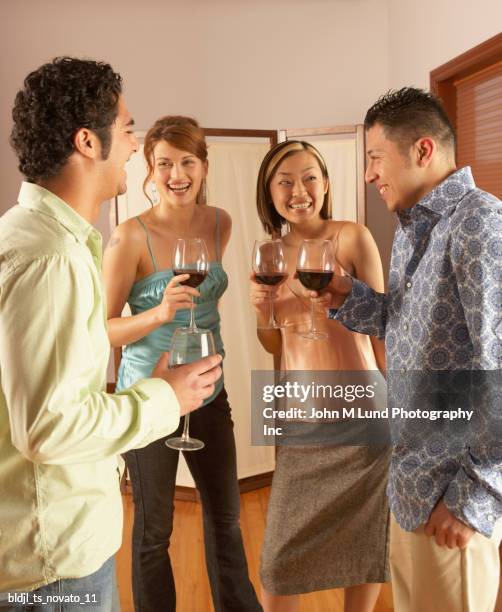 group of young people toasting with wine - john lund stock-fotos und bilder