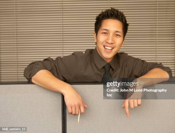 portrait of a businessman smiling in an office - lund stockfoto's en -beelden