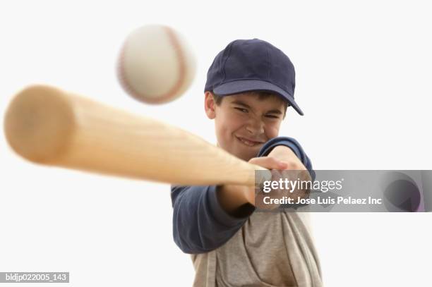 boy playing baseball - child batting stock pictures, royalty-free photos & images