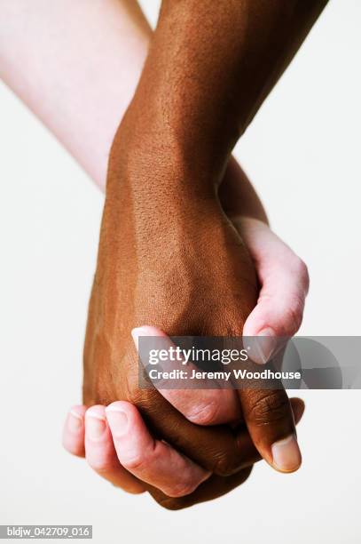 Couple Holding Hands High-Res Stock Photo - Getty Images
