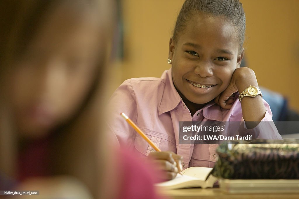 Portrait of a girl sitting in a class room