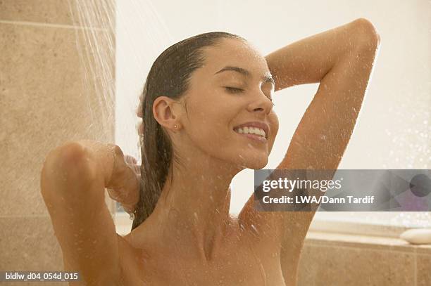woman taking a bath - bath shower stock pictures, royalty-free photos & images