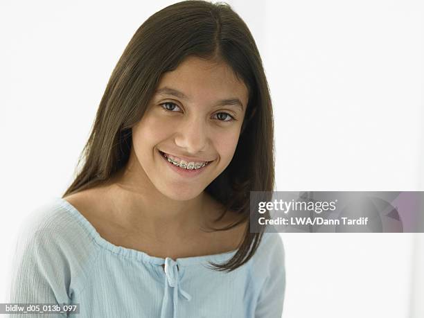 Portrait Of A Teenage Girl Smiling With Braces High-Res Stock