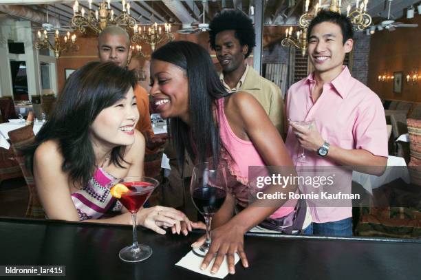 group of people enjoying in a nightclub - tangerine martini stock pictures, royalty-free photos & images