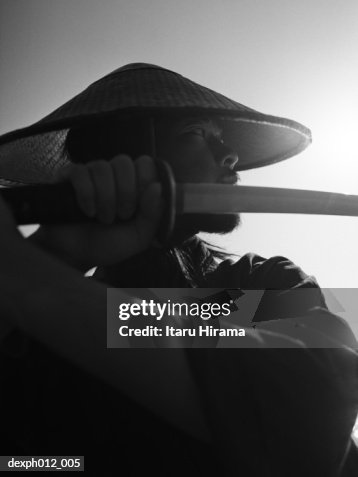 Samurai warrior holding a sword Samurai warrior holding a sword