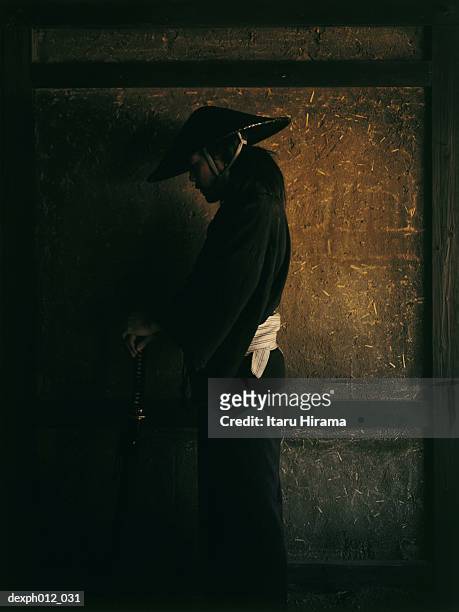 samurai warrior standing in a room - pamela frank fotografías e imágenes de stock