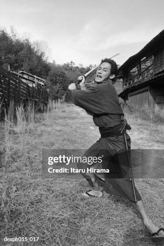 Samurai warrior strikes an attack Samurai warrior strikes an attack