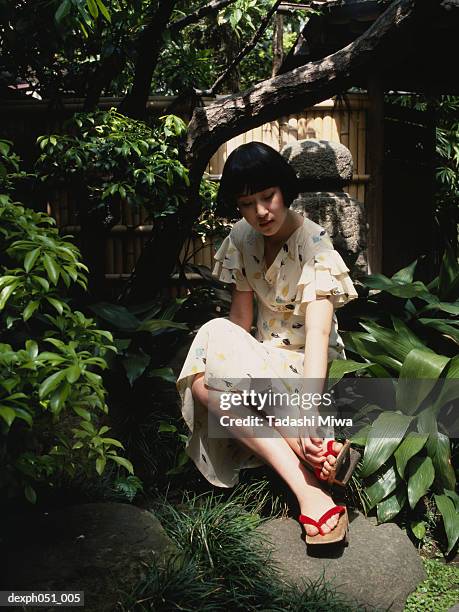 woman in japanese garden - garden feature stock pictures, royalty-free photos & images