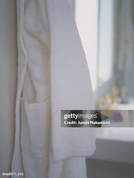 bathrobe hanging on bathroom wall - dressing table wall stock pictures, royalty-free photos & images
