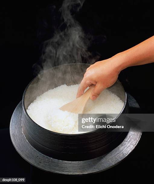 Scooping Rice Photos and Premium High Res Pictures - Getty Images
