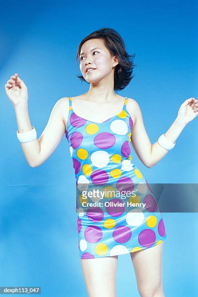 young woman in polka dot blouse, portrait - dot photos et images de collection