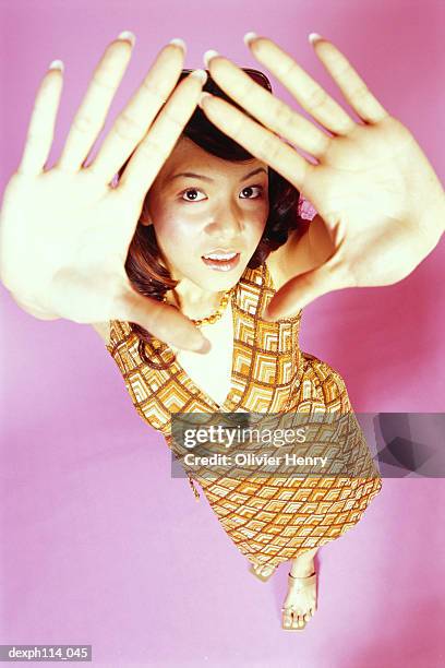 portrait of a young woman posing, high angle view - henry stockfoto's en -beelden