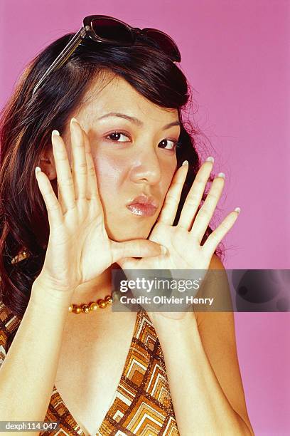 young woman gossiping, close-up - henry stockfoto's en -beelden