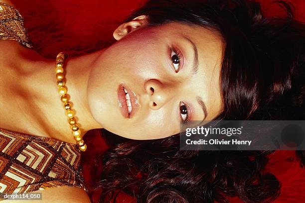 sexy woman lying on carpeted floor, close-up - henry stockfoto's en -beelden