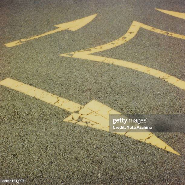 arrow road markings on road, close-up - generic safety sign stock pictures, royalty-free photos & images