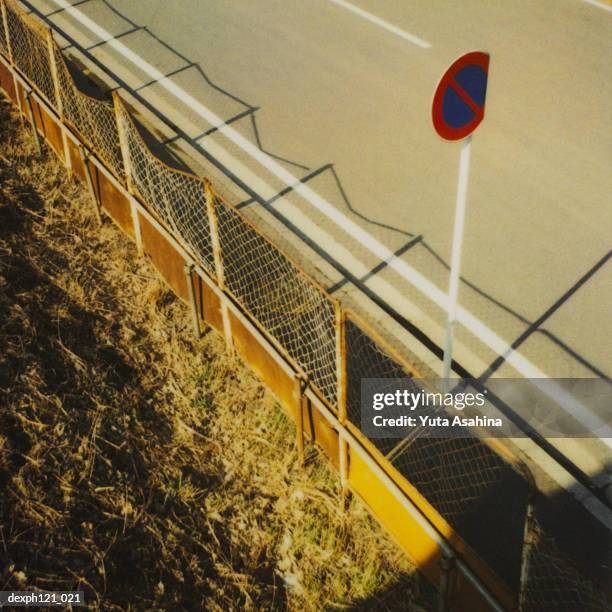 dented road sign by the roadside - generic safety sign stock pictures, royalty-free photos & images