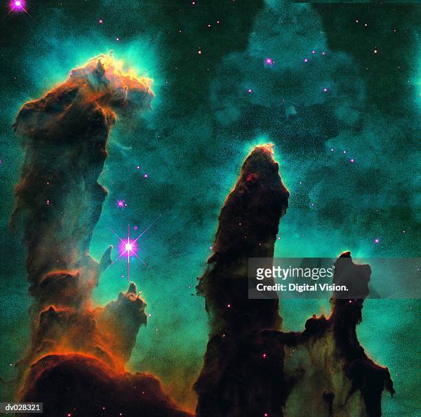 gaseous pillars in the eagle nebula - nebulosa del águila fotografías e imágenes de stock