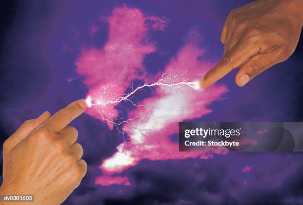 fingers pointing towards each other, lightening between them, moody background - religiöses ereignis stock-fotos und bilder