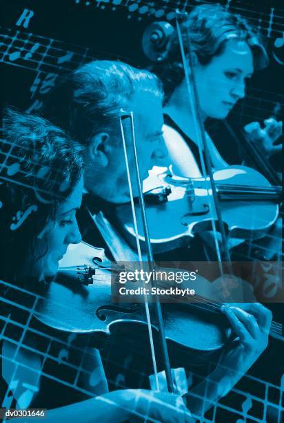 violinists superimposed with sheet music - strings section stock pictures, royalty-free photos & images