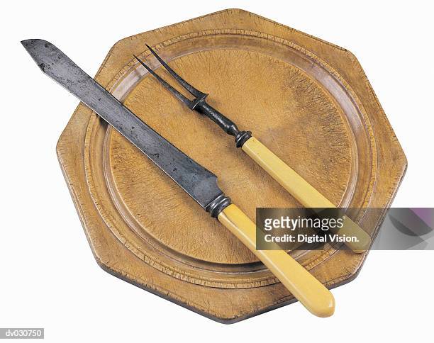 cutting board with serving knife and fork - carving set stock pictures, royalty-free photos & images