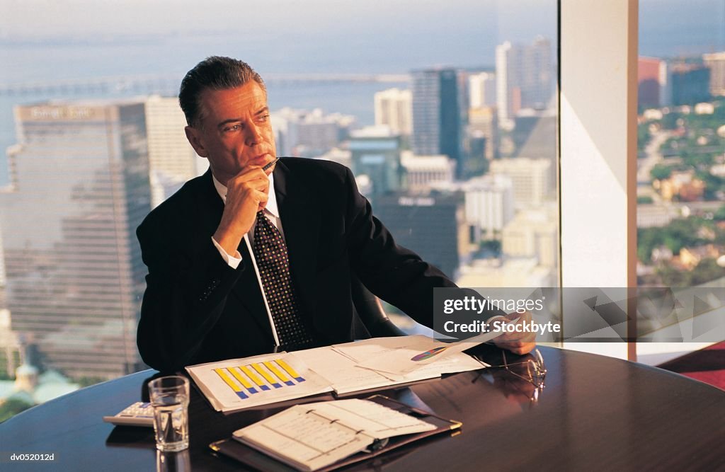 One Businessman working at desk