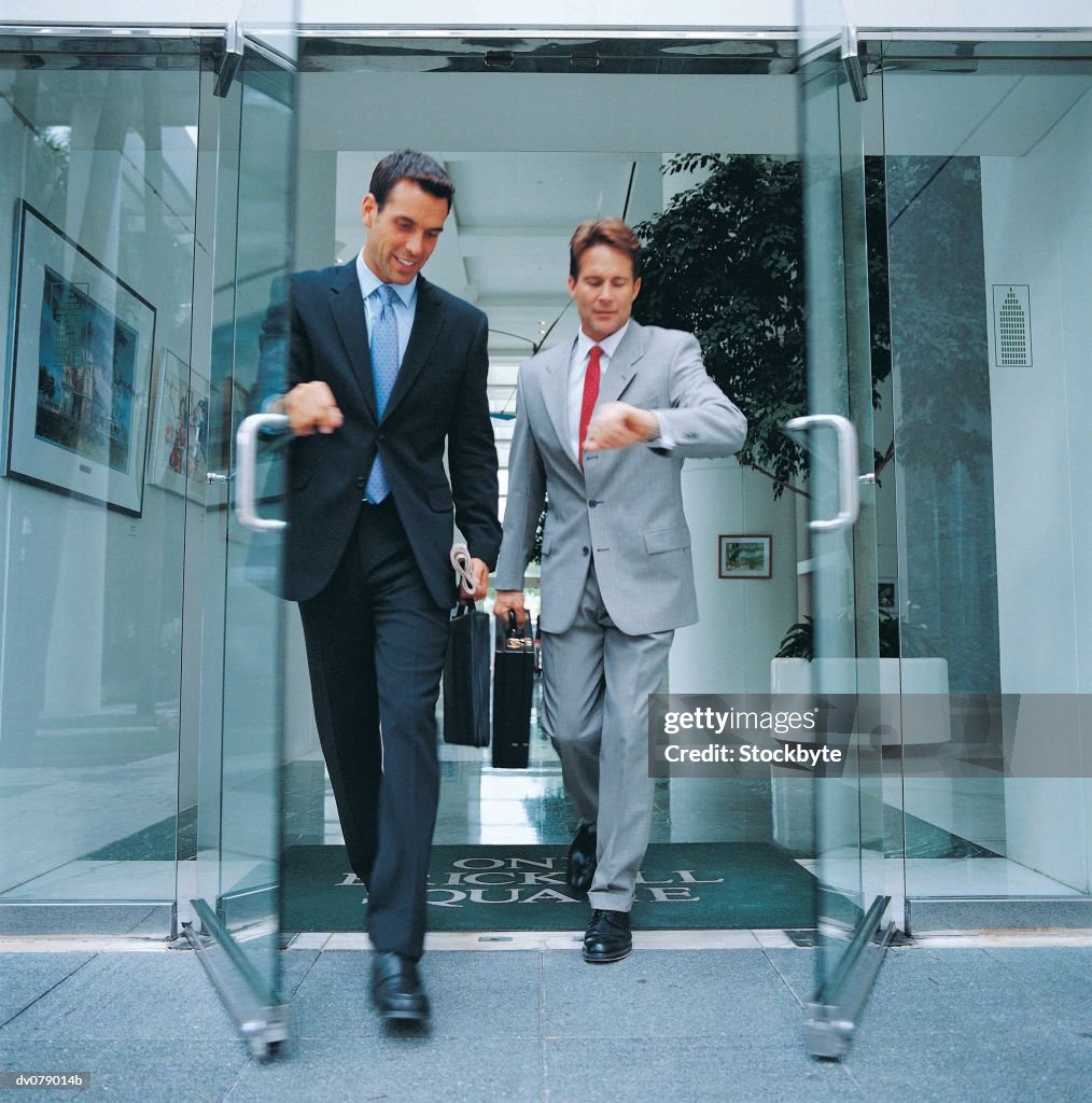 Two men leaving building together