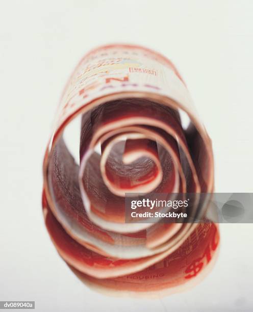 singapore ten dollar note - rolled - singapore currency stock pictures, royalty-free photos & images